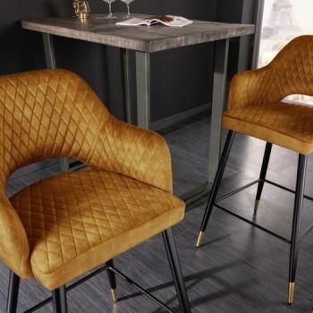 Estila Art deco zamatová barová stolička Fribourg v horčicovo žltej farbe s opierkami na čiernych nožičkách 104cm obrázok